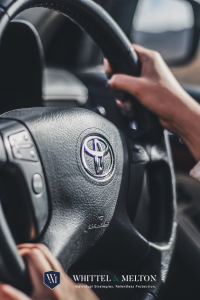 A Person Holding a Steering Wheel by Keenan Constance 